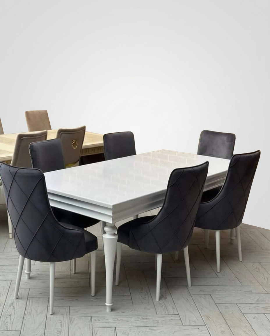 White lacquered extendable table with diamond-stitched charcoal velvet chairs