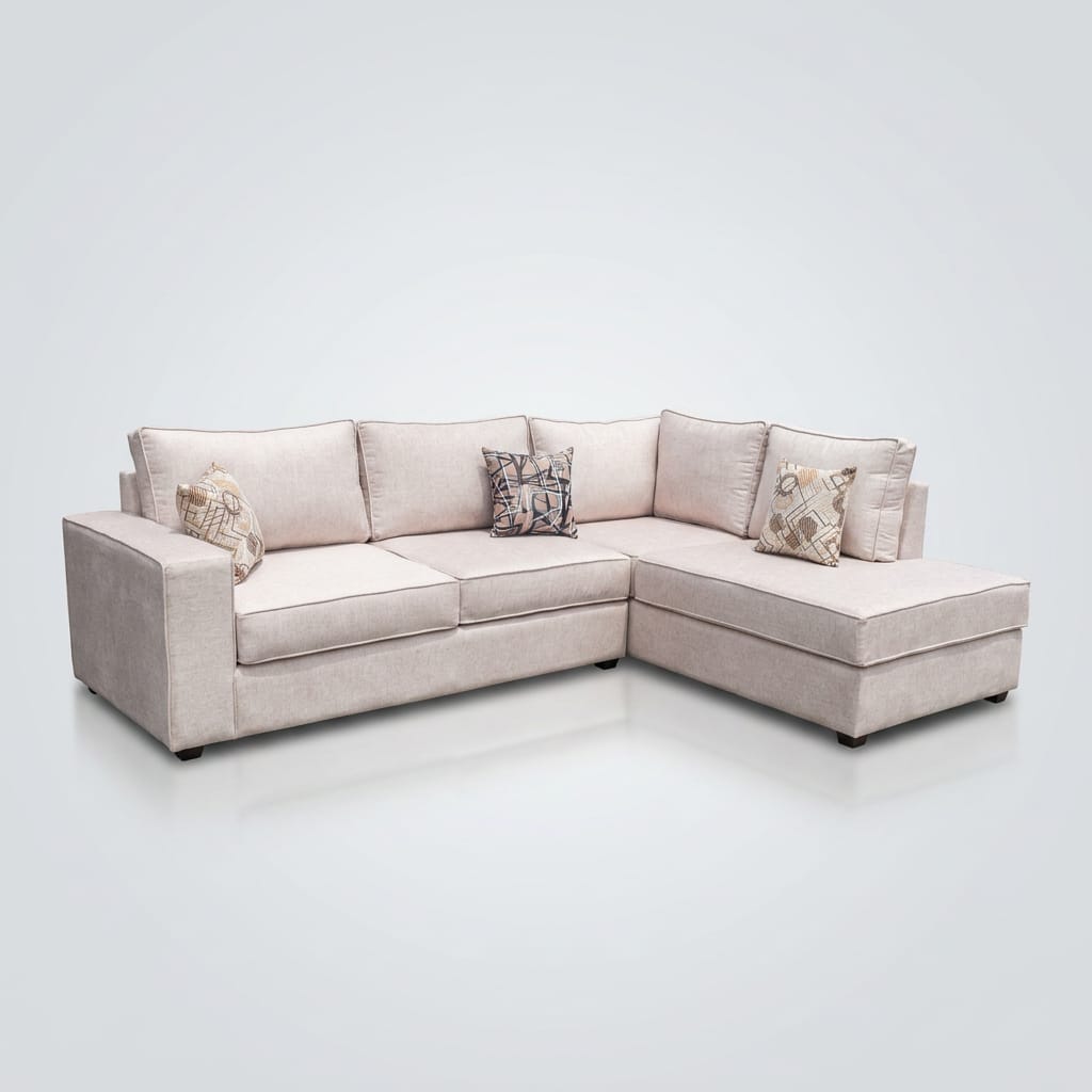 Cream linen L-sectional with chaise and patterned scatter cushions