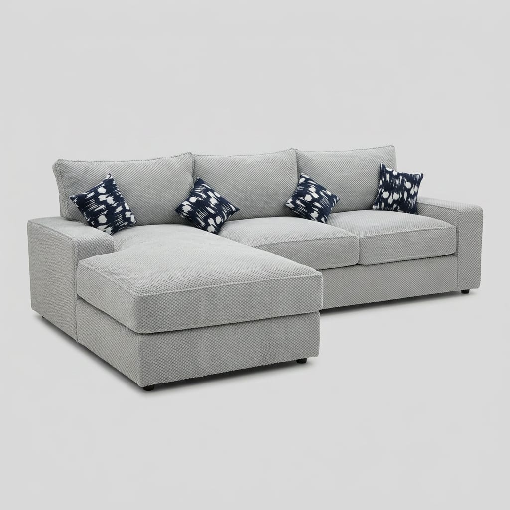 Light grey pebble weave L-shape sofa with chaise and indigo patterned pillows